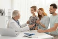 Family with child visiting doctor