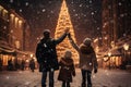 A family with a child walks in a festive city near a Christmas tree