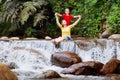 Family with child at waterfall. Travel with kids