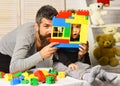 Family and childhood concept. Boy and bearded man play together Royalty Free Stock Photo