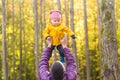 Family, childhood, fatherhood, leisure and people concept - happy father and little son playing outdoors Royalty Free Stock Photo