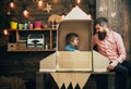 Family and childhood. family of small boy in paper rocket with father. Royalty Free Stock Photo