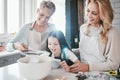 .Family, children and baking with a grandmother, mother and daughter in the kitchen together for learning. Food, cooking Royalty Free Stock Photo