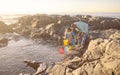 Family, children and beach with a father and daughter bonding by a rock pool during summer together. Kids, fishing or Royalty Free Stock Photo