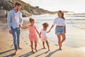 Family, children and beach of mother and man holding hands on sea sand. Summer vacation of happy fun people with kids Royalty Free Stock Photo