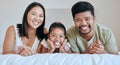 Family, children and bed with a mother, father and daughter lying in a bedroom of their home together. Relax, love and Royalty Free Stock Photo