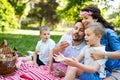 Family with children blow soap bubbles outdoors Royalty Free Stock Photo