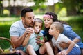 Family with children blow soap bubbles outdoors Royalty Free Stock Photo