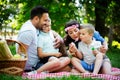 Family with children blow soap bubbles outdoors Royalty Free Stock Photo