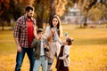 Young family with two children playing with soap bubbles Royalty Free Stock Photo