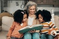 Family children, book and grandma reading fantasy storybook, story or bond on home living room sofa. Love, grandma Royalty Free Stock Photo