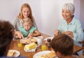 Family, children and breakfast food with grandmother for healthy nutrition meal, wellness or bonding. Women, eating and Royalty Free Stock Photo