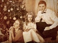 Family with children dressing Christmas tree. Royalty Free Stock Photo