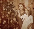 Family with children dressing Christmas tree. Royalty Free Stock Photo