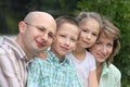 Family with children in early fall park near pond Royalty Free Stock Photo