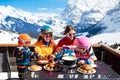 Family apres ski lunch in mountains. Skiing fun Royalty Free Stock Photo