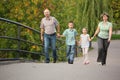 Family with children is handies on bridge Royalty Free Stock Photo