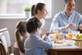 Family with children having breakfast in the kitchen Royalty Free Stock Photo