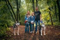 Family with children, and husky dogs in the forest Royalty Free Stock Photo