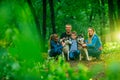 Family with children, and husky dogs in the forest Royalty Free Stock Photo