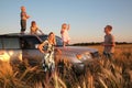 Family with children on offroad car