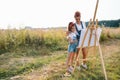 family, children and people concept - happy mother and daughter drawing and talking over green background. Mother& x27;s Royalty Free Stock Photo