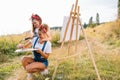 family, children and people concept - happy mother and daughter drawing and talking over green background. Mother& x27;s Royalty Free Stock Photo