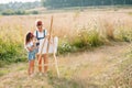 family, children and people concept - happy mother and daughter drawing and talking over green background. Mother's Royalty Free Stock Photo