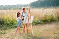 family, children and people concept - happy mother and daughter drawing and talking over green background. Mother& x27;s Royalty Free Stock Photo