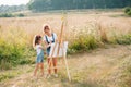 family, children and people concept - happy mother and daughter drawing and talking over green background. Mother& x27;s Royalty Free Stock Photo