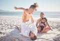 Family, children and playing with a girl on a beach holiday with her parents and sister during summer. Kids, travel and Royalty Free Stock Photo