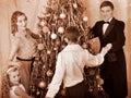 Family with children round dance Christmas tree. Royalty Free Stock Photo
