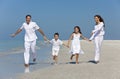 Family With Children Running Having Fun At Beach Royalty Free Stock Photo
