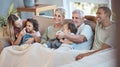 Family, children and watching tv grandparents, parents and kids together on a sofa in the living room of their home Royalty Free Stock Photo