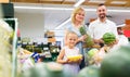 Family choosing fruits in hypermarket. Royalty Free Stock Photo