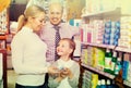 Family choosing items in pharmacy Royalty Free Stock Photo