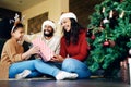 Family, christmas celebration and gift giving, happy smile and love on floor in home, festive holiday and surprise, Girl Royalty Free Stock Photo