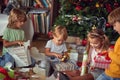 Family at  Christmas. Children under Christmas tree with presents Royalty Free Stock Photo