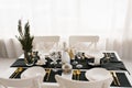 Family Christmas dinner at a set table. Living room interior in black and white Royalty Free Stock Photo