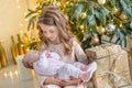 Family on Christmas eve at fireplace. Kids opening Xmas presents. Children under Christmas tree with gift boxes. Decorated living Royalty Free Stock Photo