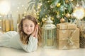 Family on Christmas eve at fireplace. Kids opening Xmas presents. Children under Christmas tree with gift boxes. Decorated living Royalty Free Stock Photo