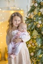 Family on Christmas eve at fireplace. Kids opening Xmas presents. Children under Christmas tree with gift boxes. Decorated living Royalty Free Stock Photo