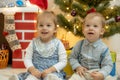 Family on Christmas eve at fireplace. Mother and little kids opening Xmas presents. Children with gift boxes. Living Royalty Free Stock Photo