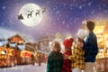 Family at Christmas fair in snow. Xmas market Royalty Free Stock Photo