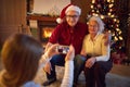 Family on Christmas photographing with smartphone Royalty Free Stock Photo