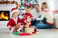 Family at Christmas tree. Parents and kids on Xmas Royalty Free Stock Photo