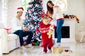 Family at Christmas tree. Parents and kids on Xmas Royalty Free Stock Photo