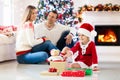 Family at Christmas tree. Parents and kids on Xmas Royalty Free Stock Photo