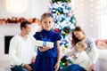 Family at Christmas tree. Parents and kids on Xmas Royalty Free Stock Photo