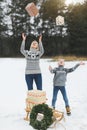 Family, christmas, x-mas, winter, happiness and people concept - smiling family, mom and son, in knitted sweaters Royalty Free Stock Photo